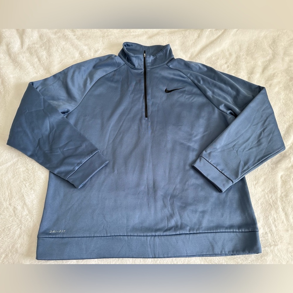 Nike Men’s Dri-FIT 1/4-zip pullover in blue
Size XL